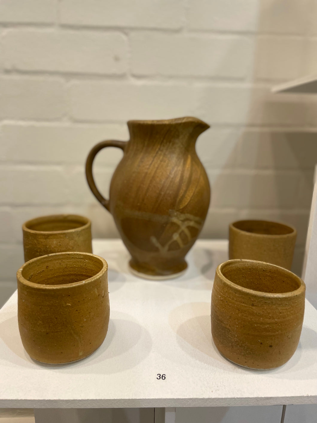 Large Pitcher and Four Tumblers, Brown Glaze